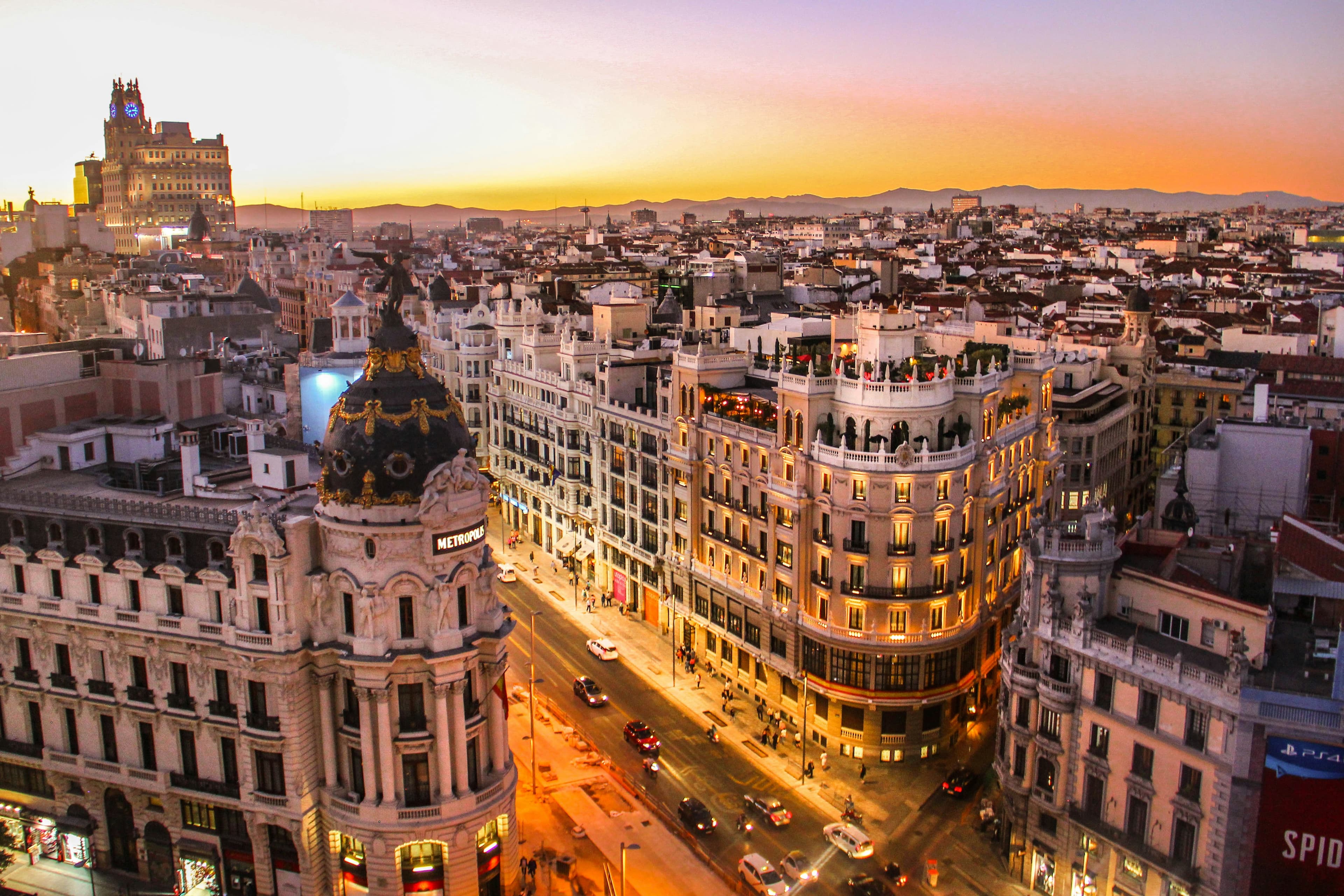 Madrid cityscape with iconic Gran Via boulevard at dusk